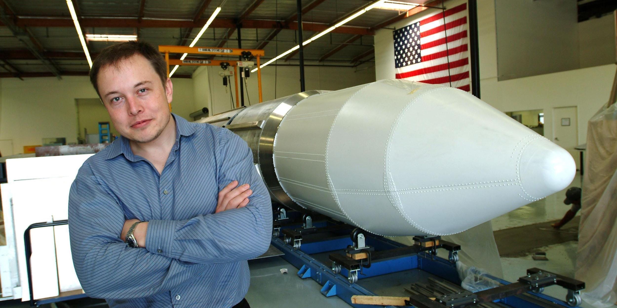 Elon Musk, the founder of SpaceX, stands beside a rocket in Los Angeles in 2004.