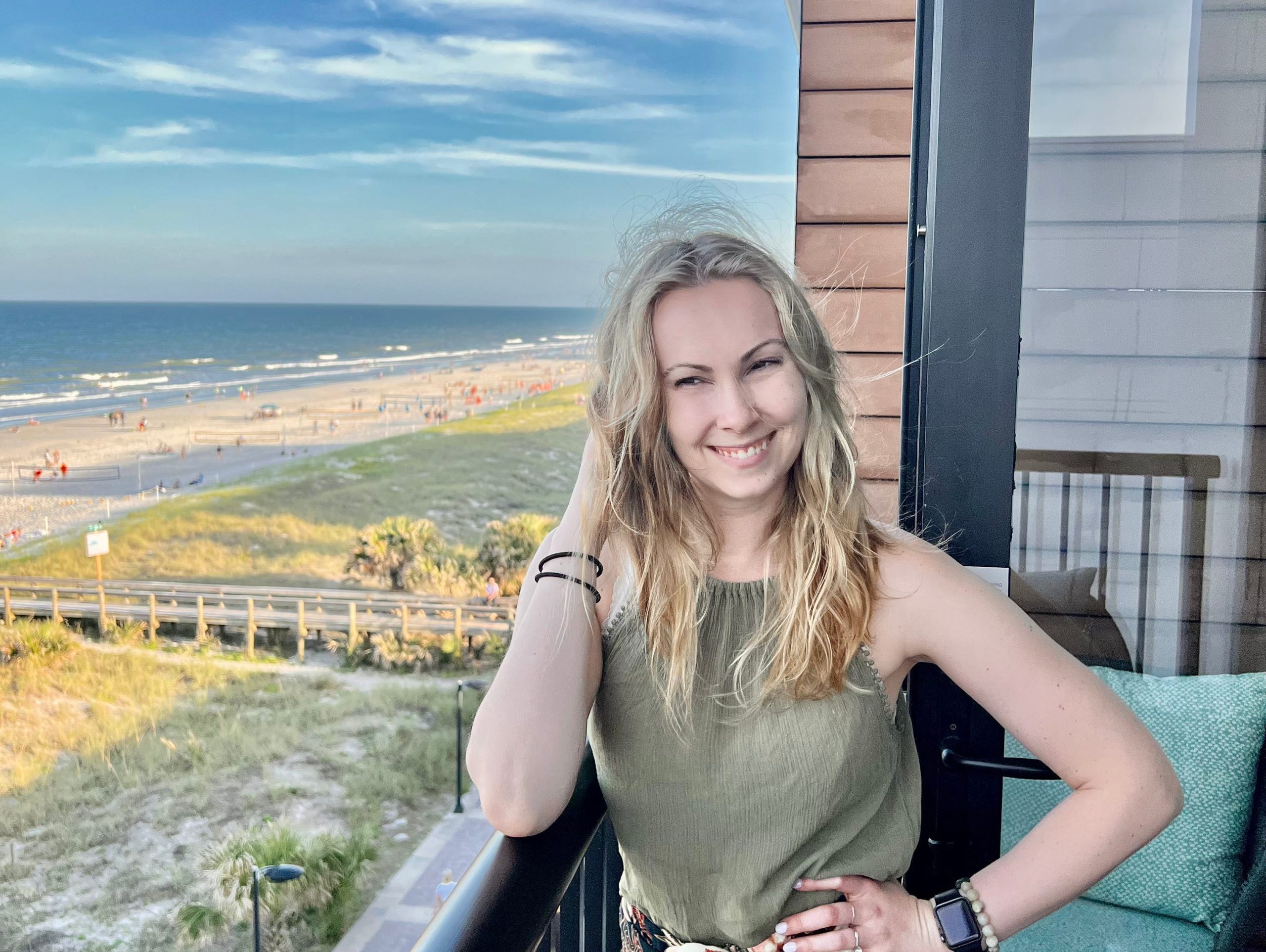 molly posing on a beachfront balcony in jacksonville beach florida