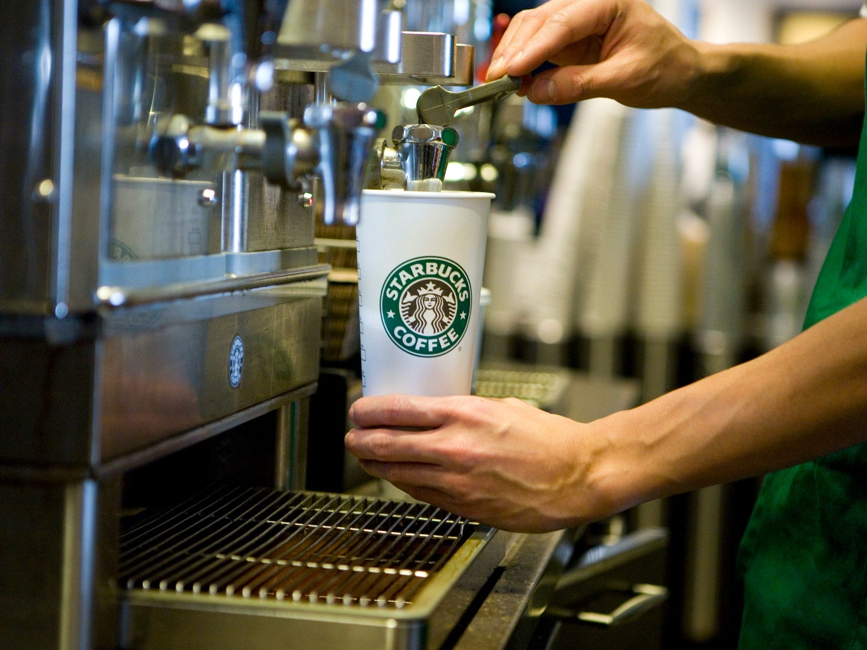 A Starbucks barista prepares a drink at a Starbucks Coffee Shop location in New York.