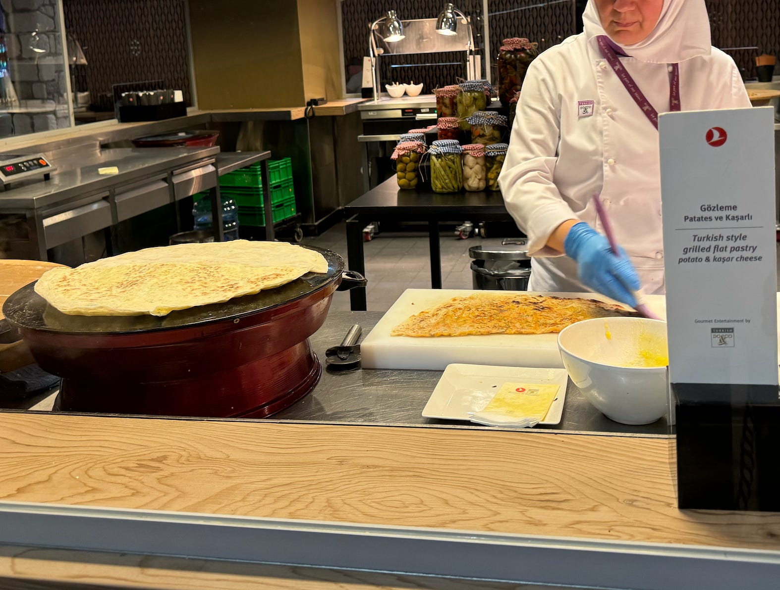 Individual preparing food at airport 