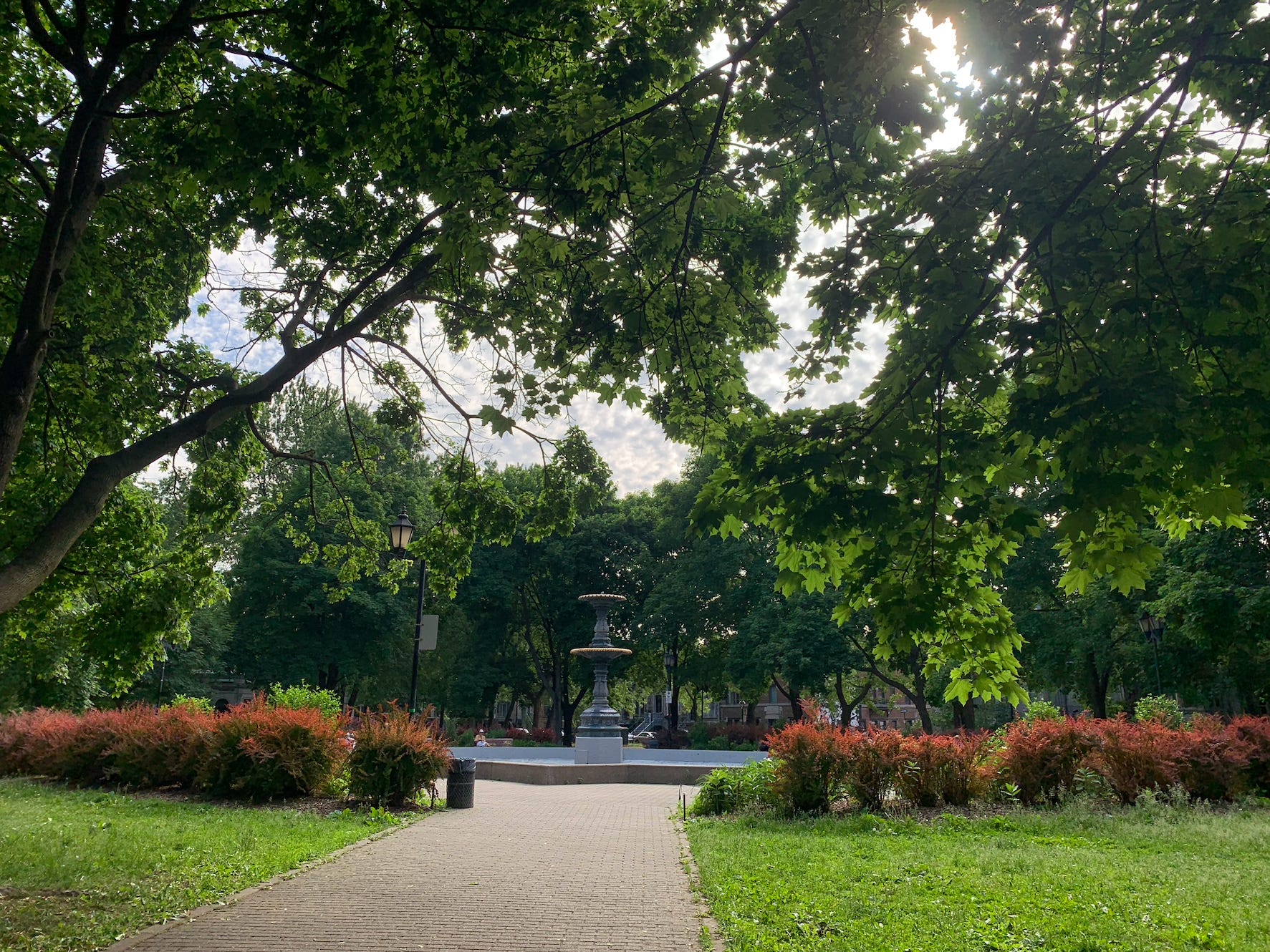 fountain in st louis square park in Montreal on a nice day