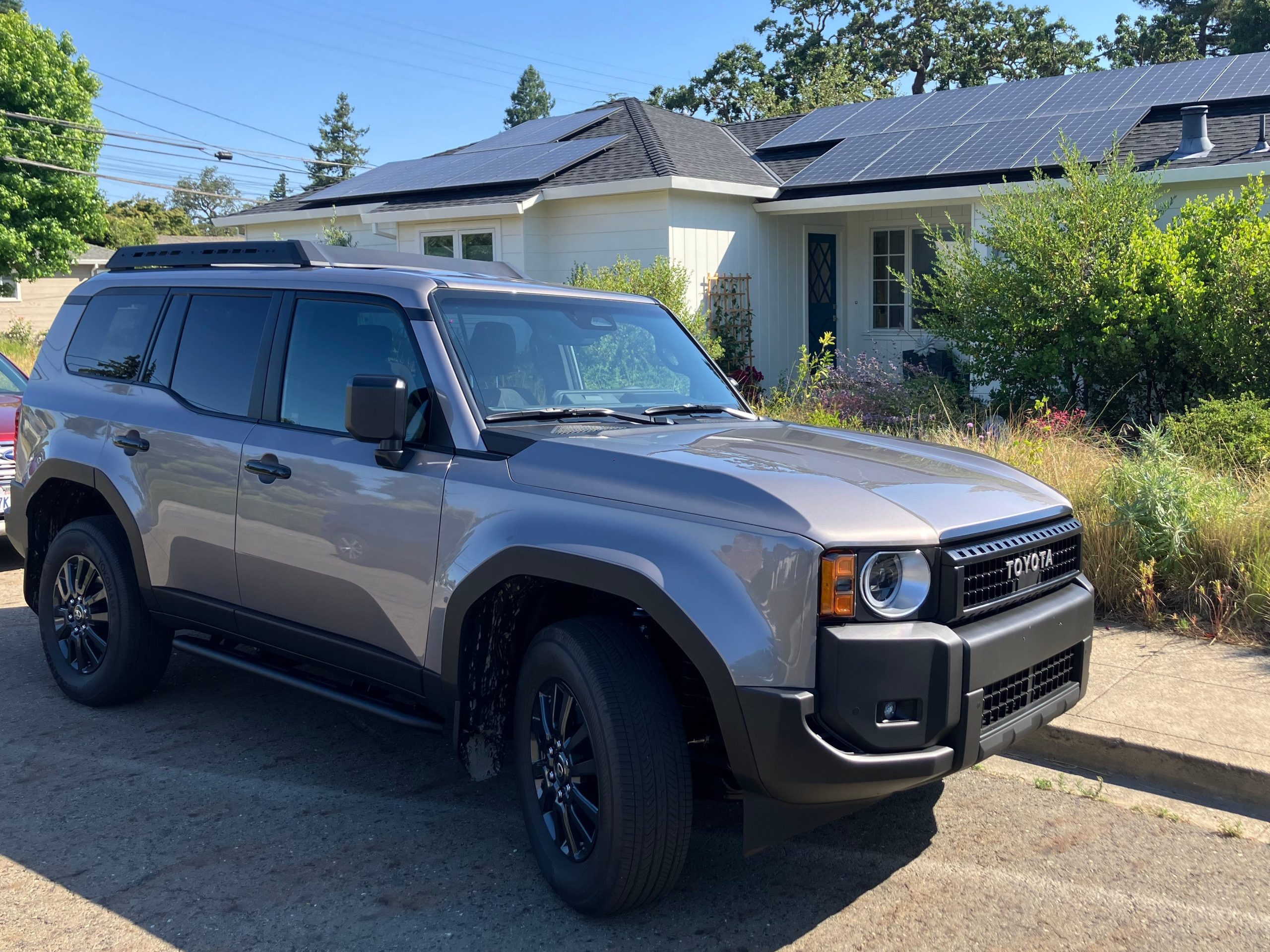 A Toyota Land Cruiser parked in front of a house in Silicon Valley