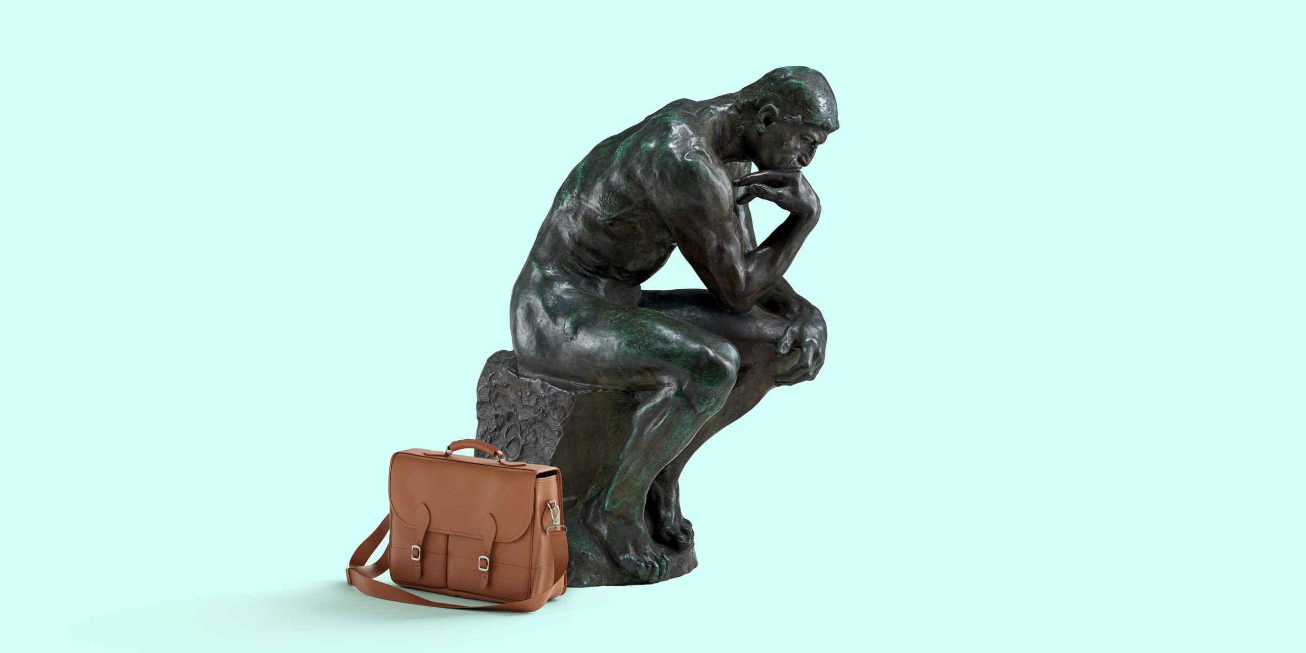 Image of a statue thinking and a briefcase.