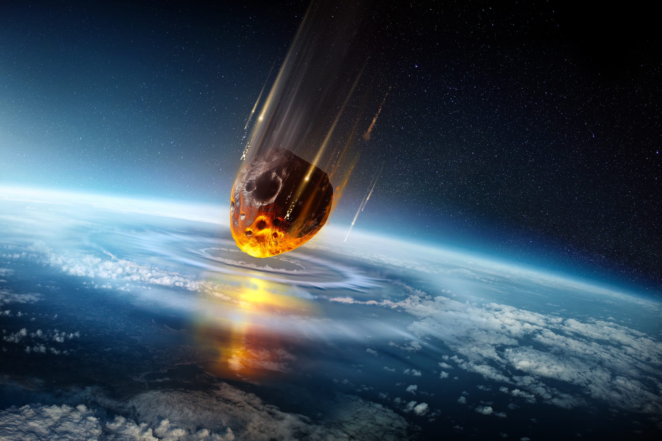 An artist's illustration of a massive asteroid colliding with Earth