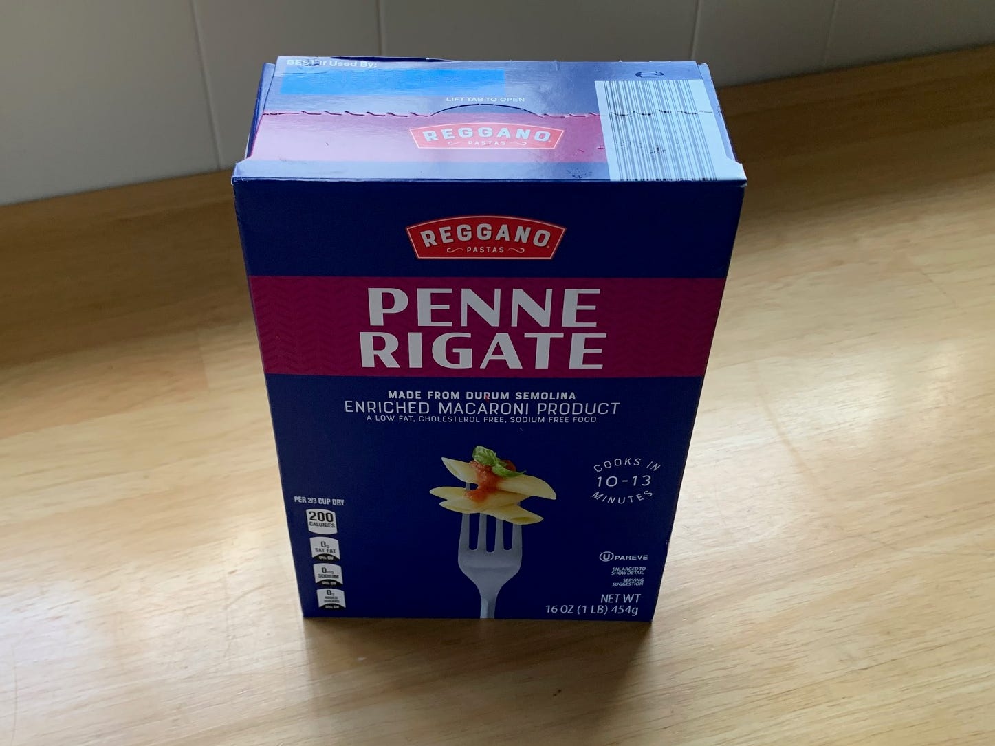 box of penne pasta on a kitchen counter