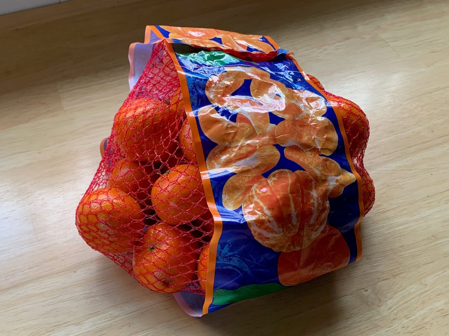 bag of mandarin oranges ona. kitchen counter