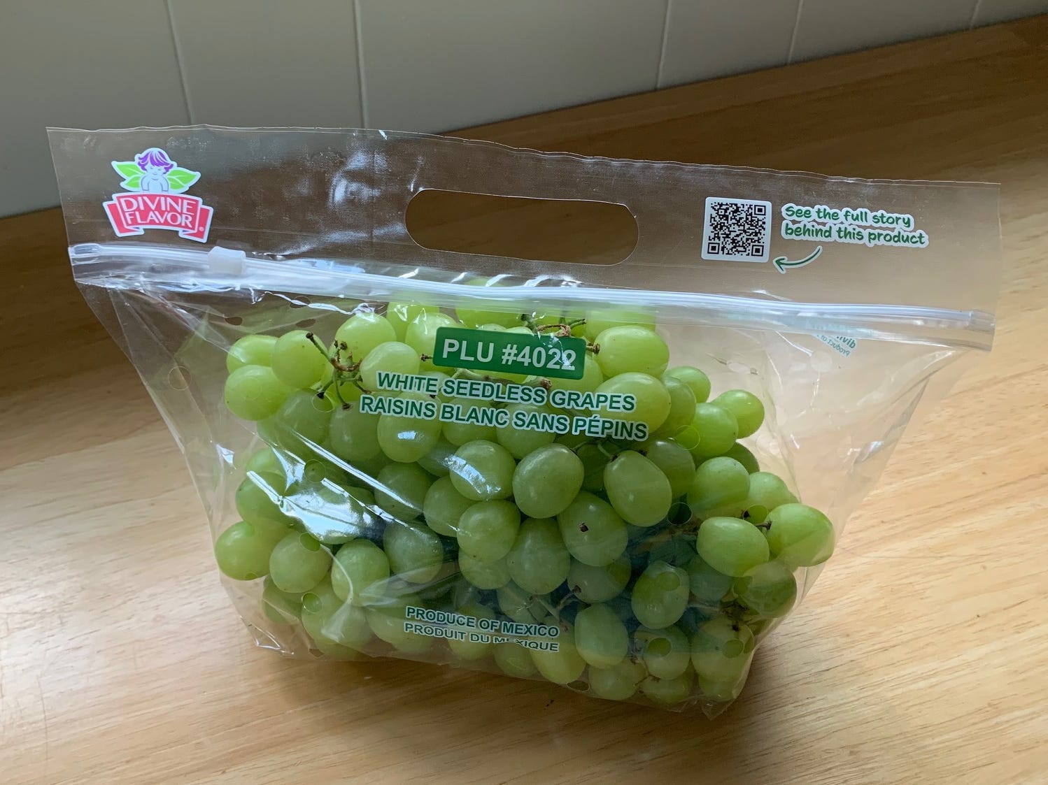 bag of green grapes on a kitchen counter