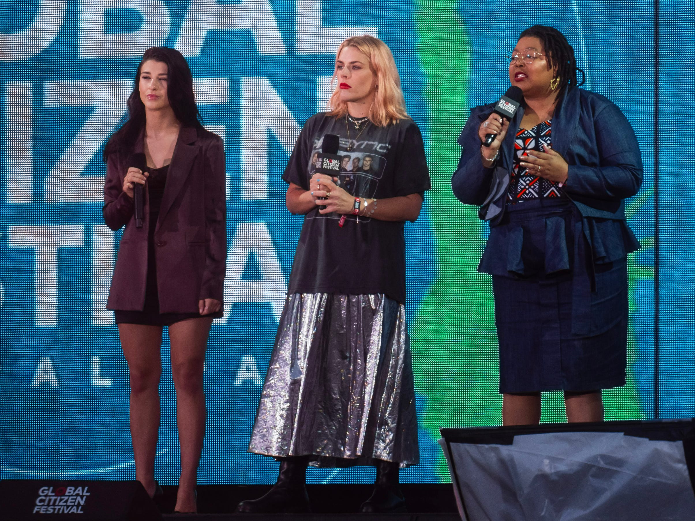 Phoebe Gates, Busy Philipps, and Tlaleng Mofokeng speak on stage at the Global Citizen Festival 2023